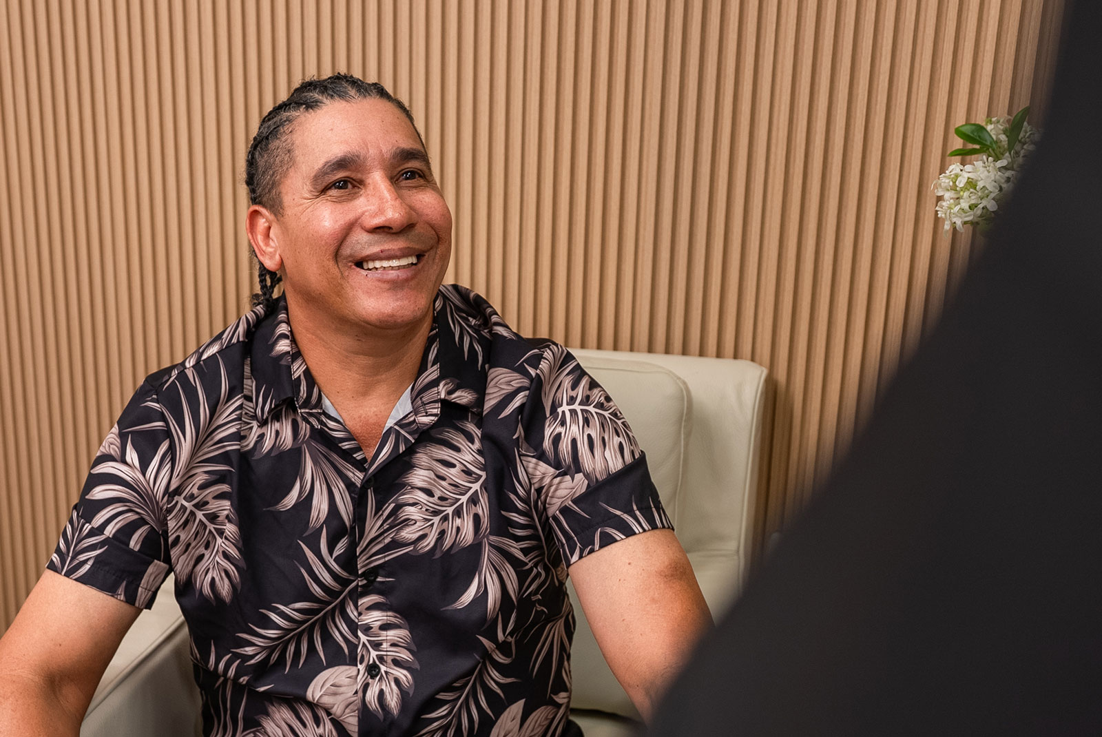man with braids listening