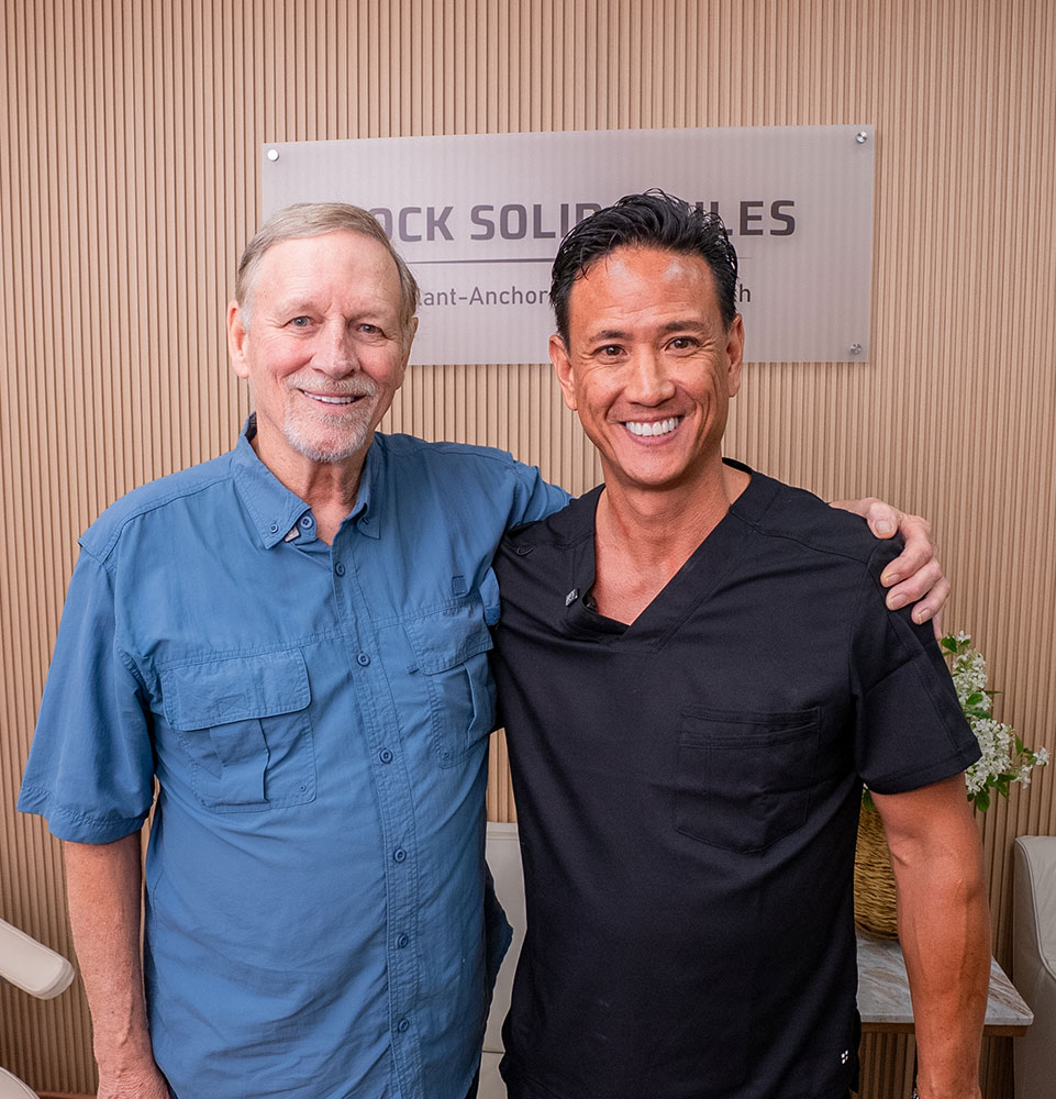 dr with man in blue shirt