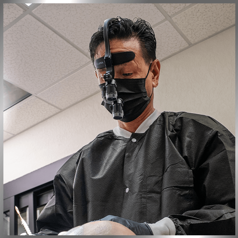 dr during procedure with glasses