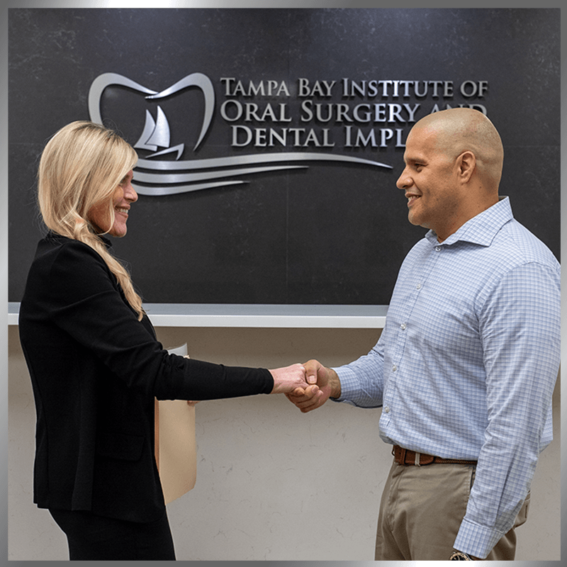 pt with polo shaking hands