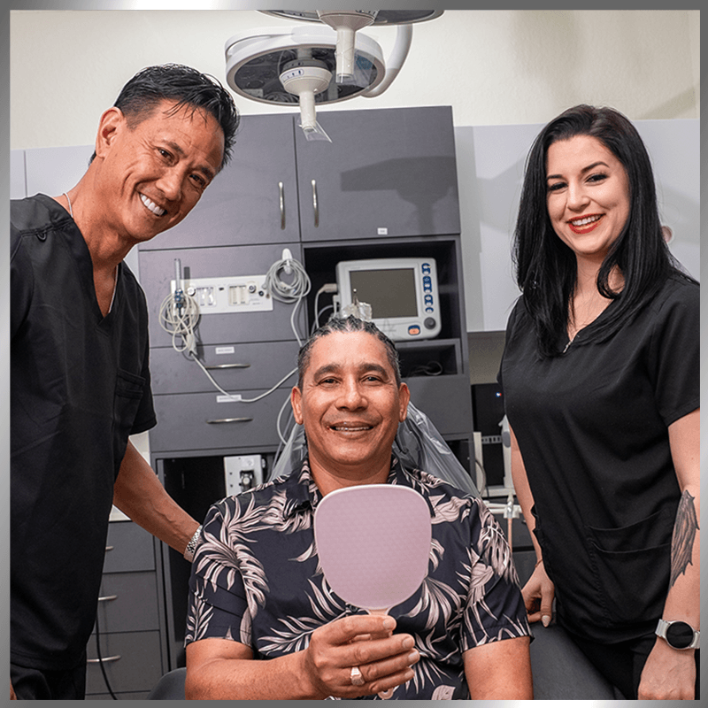dr with patient holding mirror